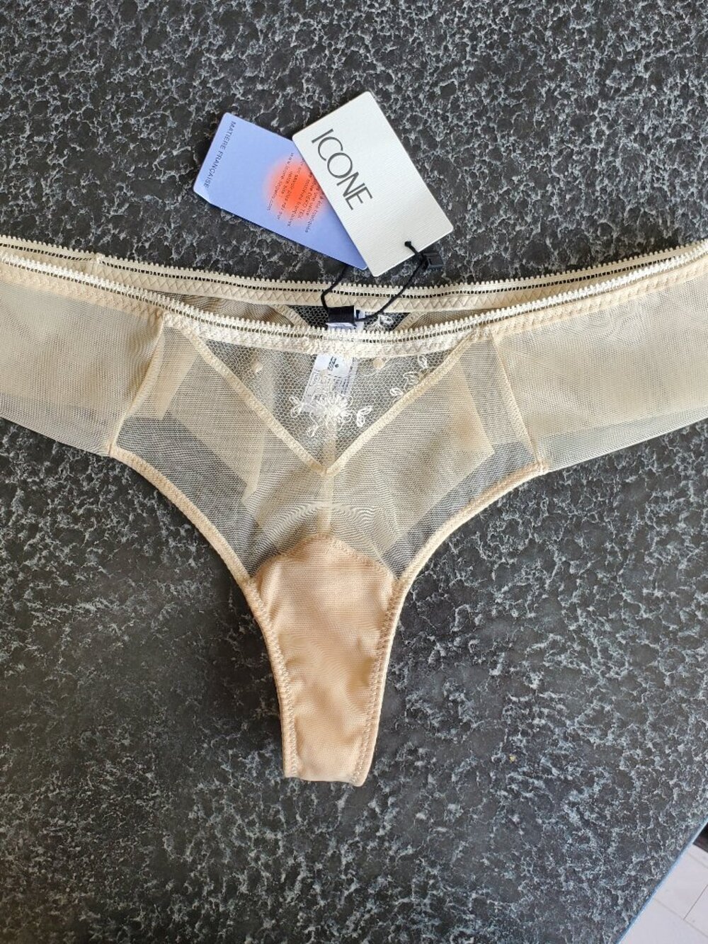 ICON ! mesh thong features delicate lace trim and a sheer design. (S)